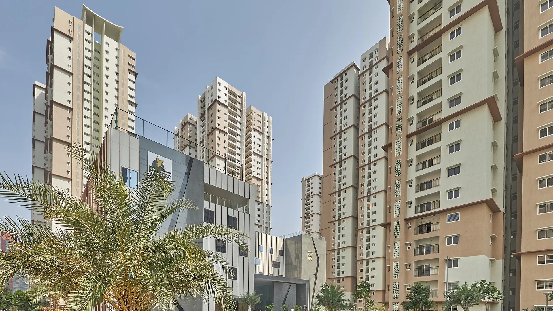 Expansive landscaped gardens, walking paths, and green open spaces inside the Prestige High Fields residential community.